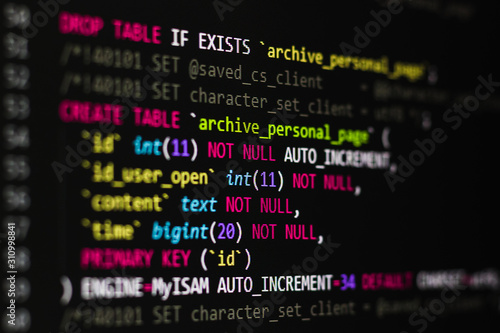 sql code on a black background on the monitor