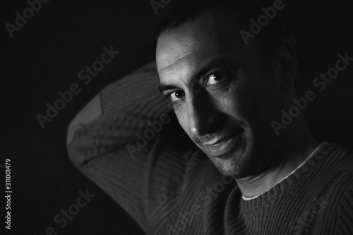 Portrait of a man, black background