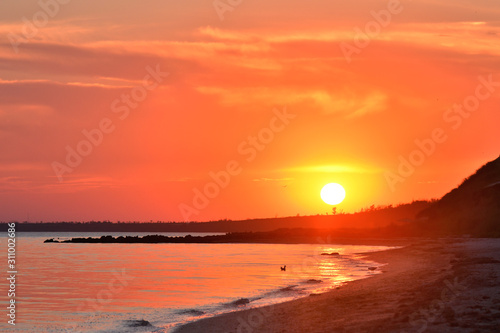 Fototapeta Naklejka Na Ścianę i Meble -  Sunset on the sea coast