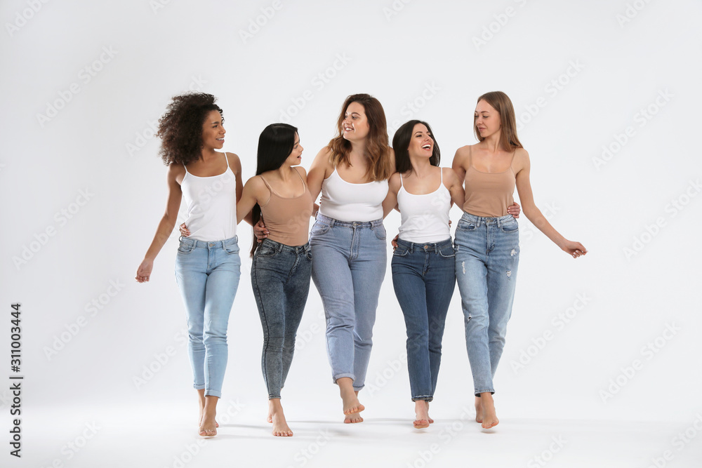 Group of women with different body types on light background - obrazy, fototapety, plakaty 