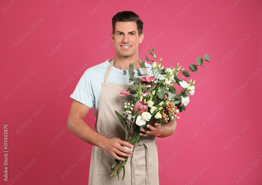 Florist with beautiful bouquet on pink background Florist with beautiful bouquet on pink background