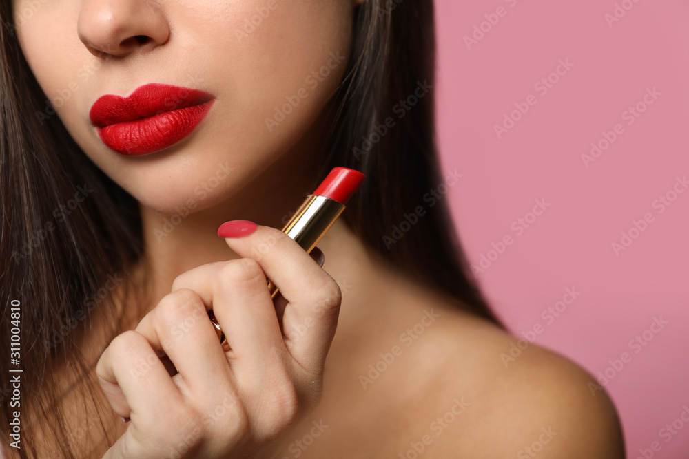 Woman with red lipstick on pink background, closeup Woman with red lipstick on pink background, closeup