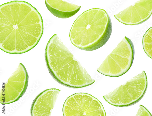 Fotografia Collage of flying cut limes on white background
