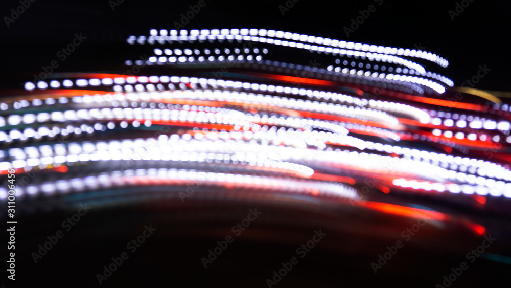 Neon lights. Dark background, abstract light. Blurred bokeh background. Neon lights. Dark background, abstract light. Blurred bokeh background.
