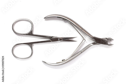 Nail clippers and scissors isolated on white background