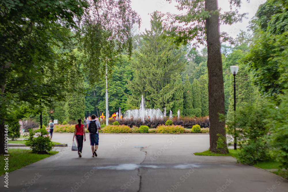 woman walking in park woman walking in park