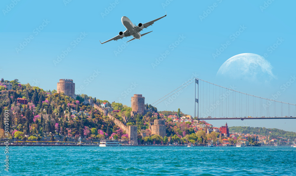 Airplane over the bosphorus sea and Istanbul bridge- Istanbul, Turkey