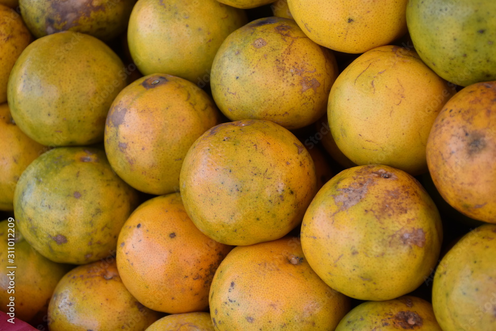 Oranges on the hand ready to sell in Thai market Oranges on the hand ready to sell in Thai market