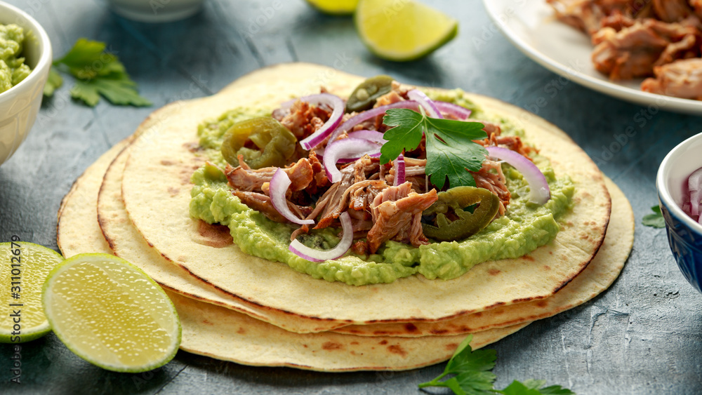 Mexican Corn tortilla with shredded Pork, avocado, red onion and jalapeno Mexican Corn tortilla with shredded Pork, avocado, red onion and jalapeno