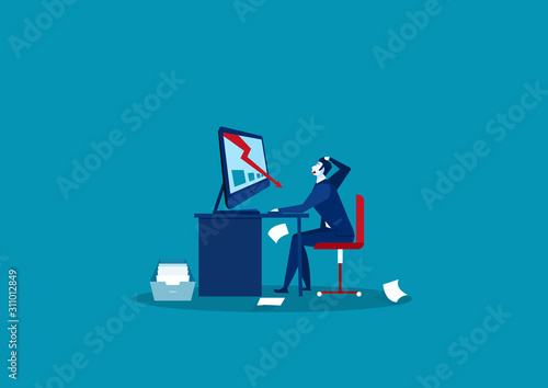 Businessman looking at the falling down graph on laptop computer