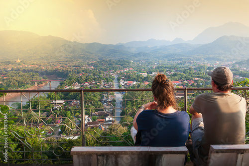 Couple travelers enjoying view Luang Prabang ancient town.