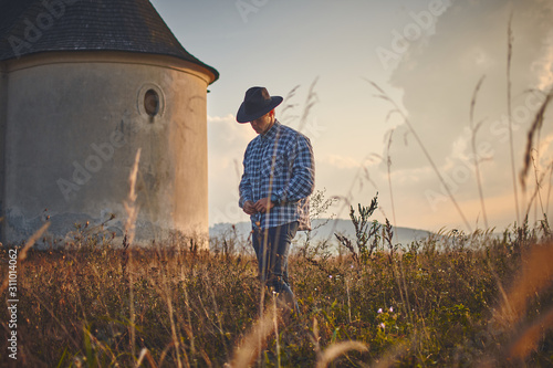 Young man hard working farmer looking with satisfied face,  vintage