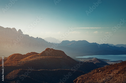 Sun rising over mountains and a bay near Loreto, Mexico
