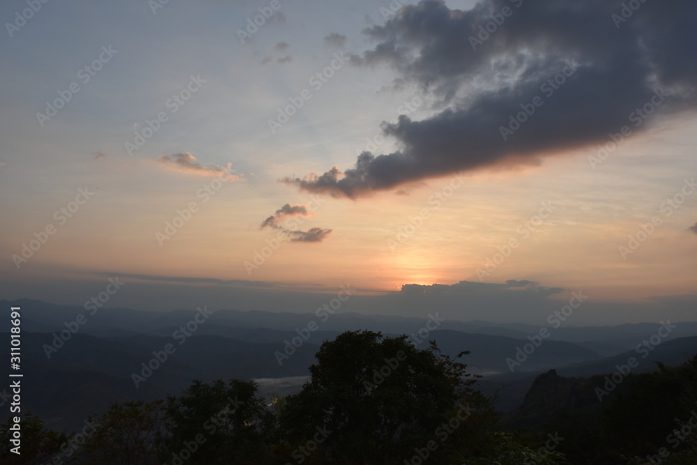 Morning clouds with the sunrise on foggy landscape Morning clouds with the sunrise on foggy landscape