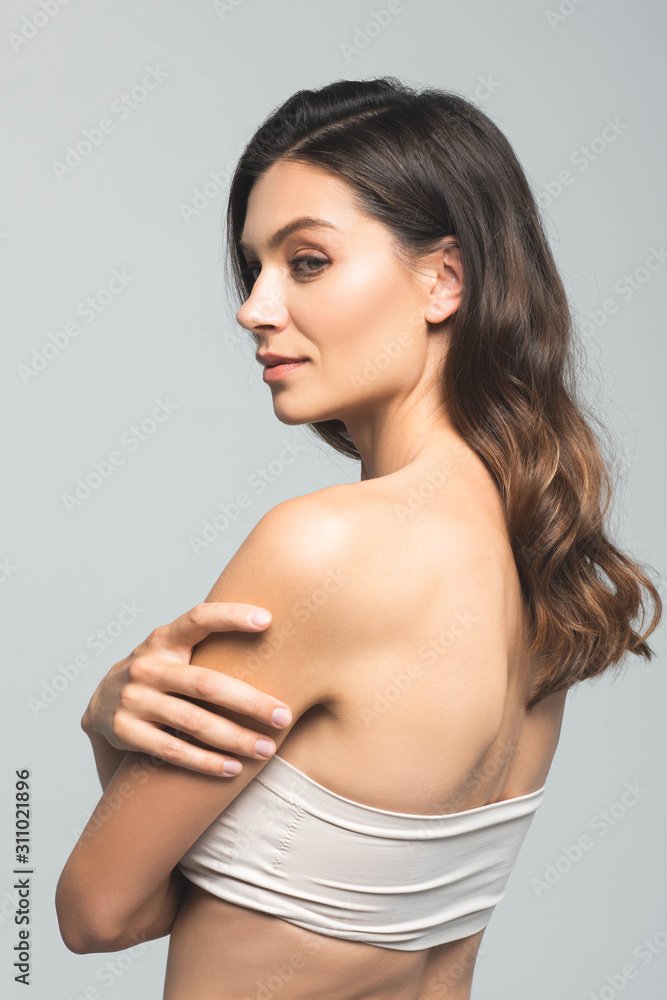 portrait of sensual brunette woman with perfect skin, isolated on grey portrait of sensual brunette woman with perfect skin, isolated on grey