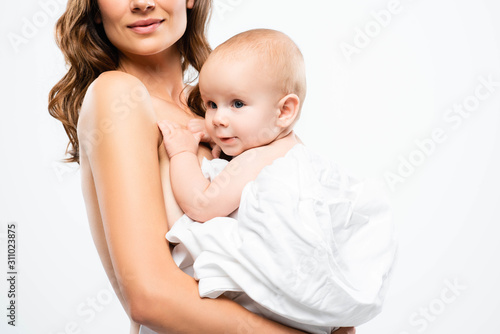 cropped view of nude tender mother holding baby, isolated on white
