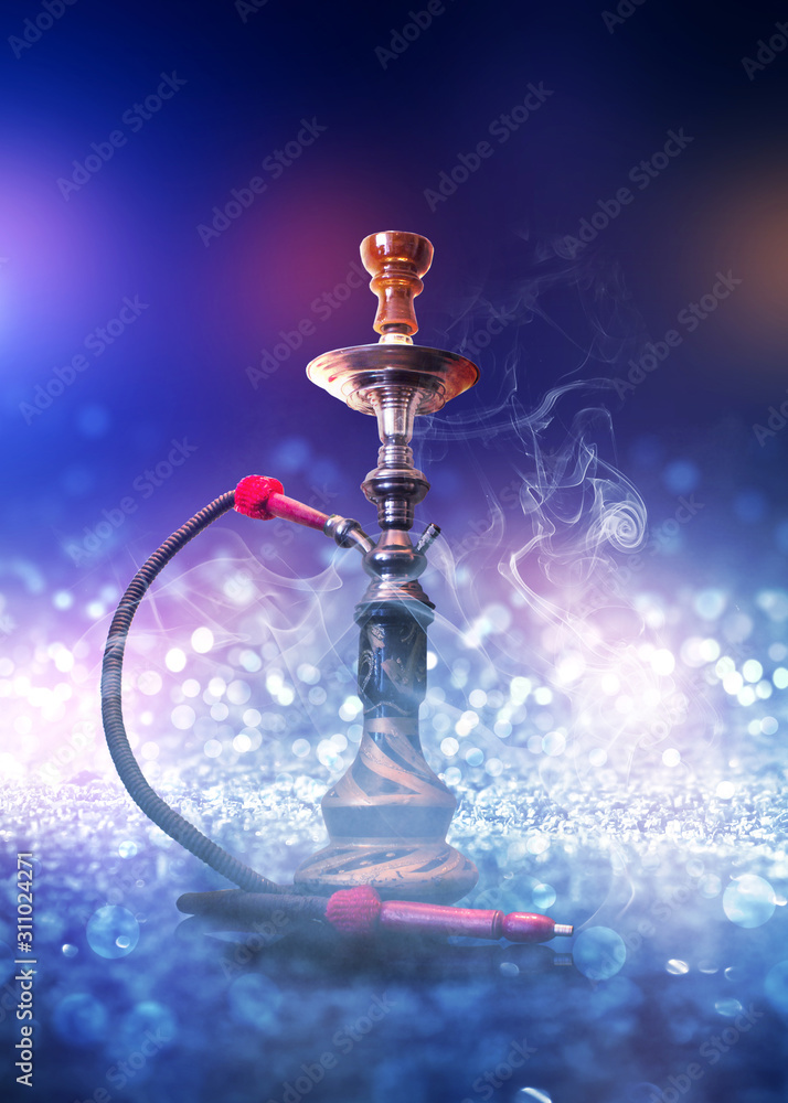 Hookah with smoke on a background of blurry lights. Abstract background, neon glow Hookah with smoke on a background of blurry lights. Abstract background, neon glow