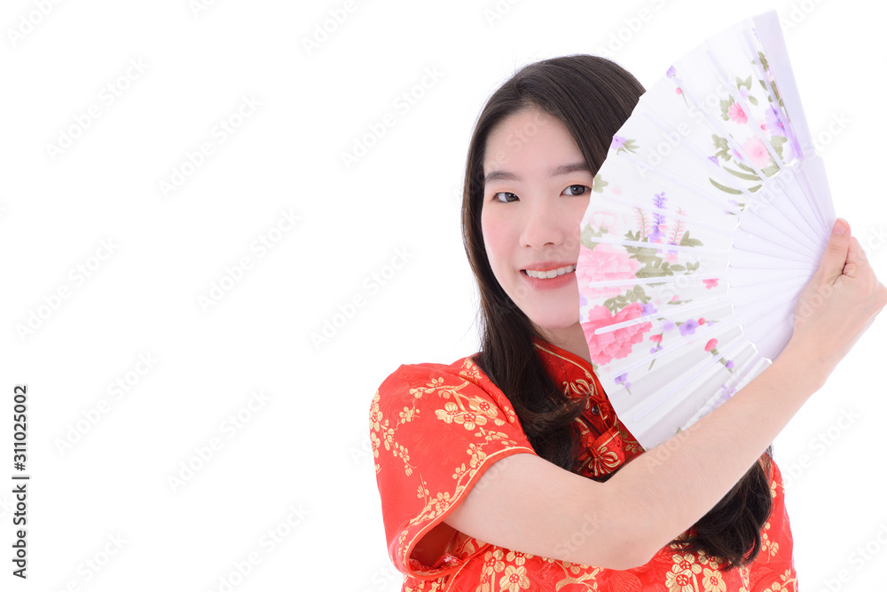 Asian woman with Chinese traditional dress cheongsam holding Chinese fan isolated on white background. Asian woman with Chinese traditional dress cheongsam holding Chinese fan isolated on white background.
