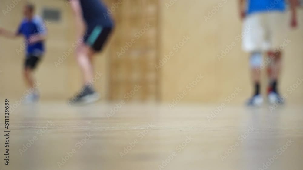 Blurry basketball players in a gym Blurry basketball players in a gym