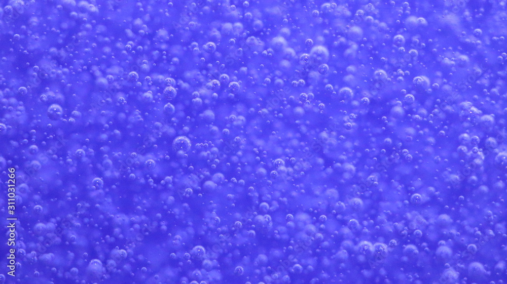Fototapeta premium Bubbles in a blue bottle