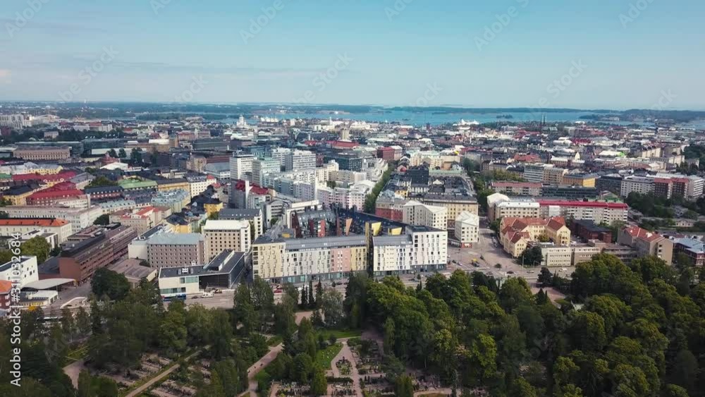 Helsinki, Finland. Aerial Drone views flying over Hietaniemi-cemetery towards city center Helsinki, Finland. Aerial Drone views flying over Hietaniemi-cemetery towards city center