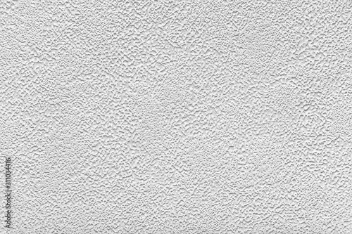 ight gray porous texture as background photo