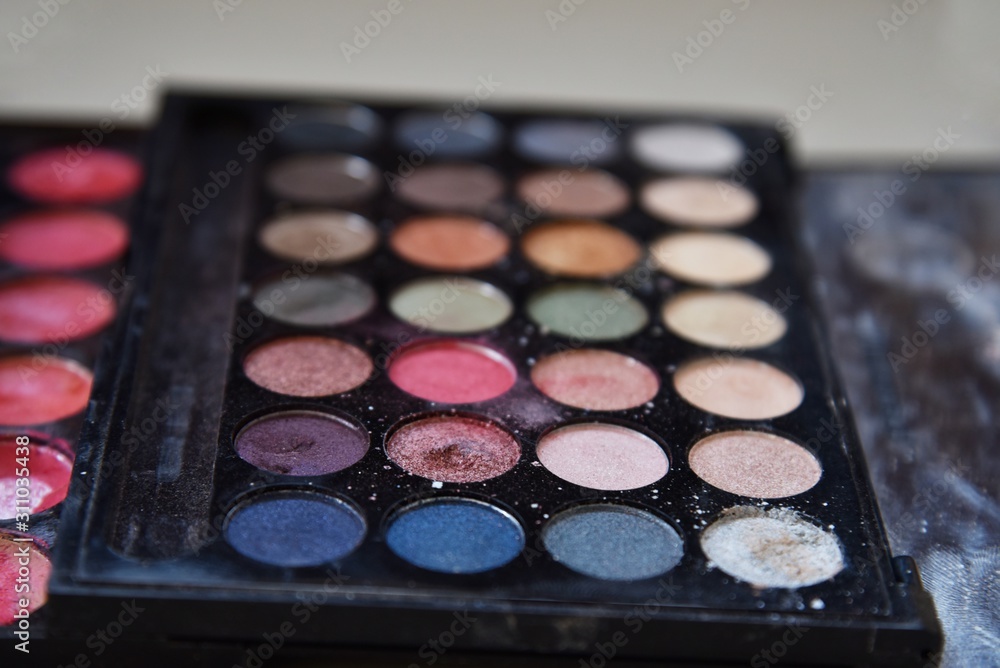 old eye shadows palette with broken on the floor old eye shadows palette with broken on the floor