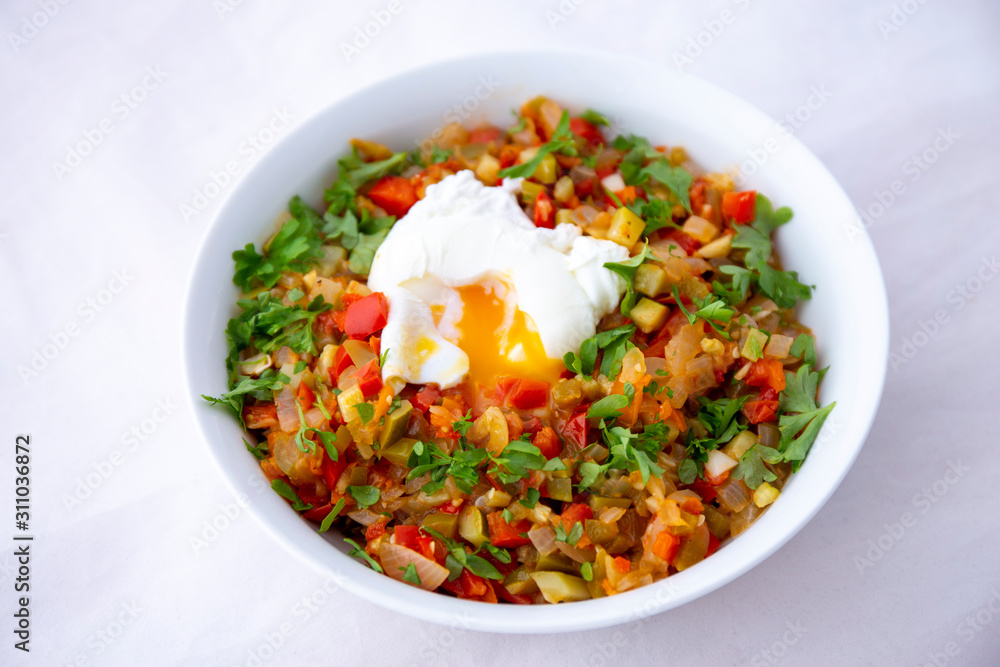 Spanish dish pisto manchego with poached egg Spanish dish pisto manchego with poached egg