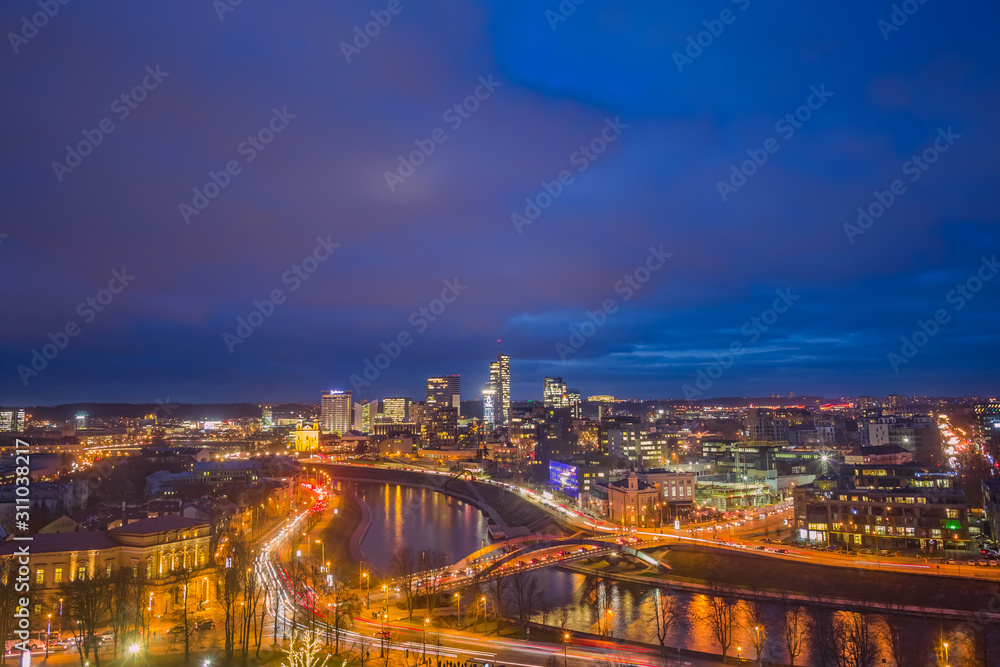Vilnius city with glowing buildings in the evening light Vilnius city with glowing buildings in the evening light