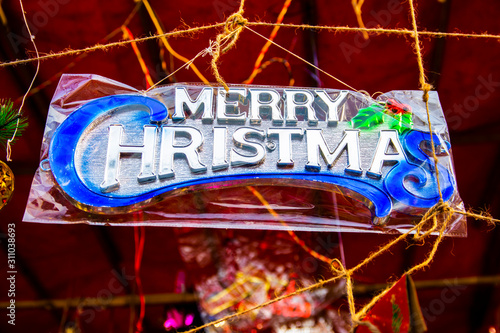 New year fair, Big sale of Christmas trees and Santa doll. Sale of artificial fir trees and festive decorations in tents. Merry Christmas and Happy New Year 2020.