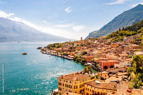 Limone Sul Garda cityscape on the shore of Garda lake surrounded by scenic Northern Italian nature. Amazing Italian cities of Lombardy