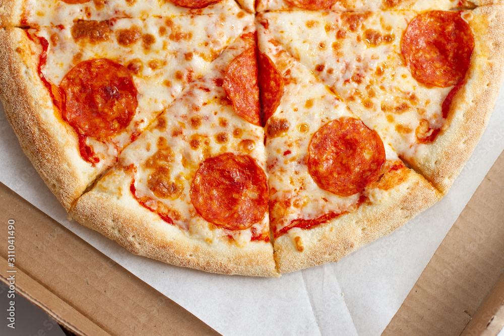Close up sliced tasty pepperoni pizza i 
