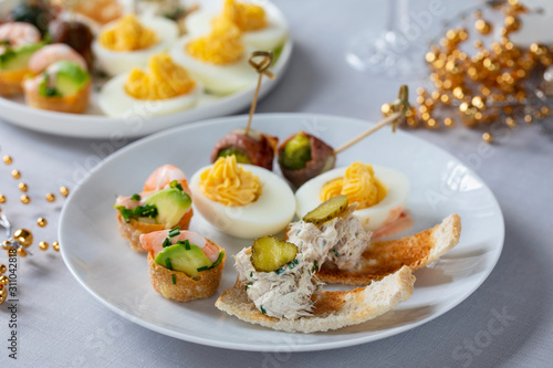 selection of festive canapes, devilled egg , mini prawn coctail, brussels sprout and toast