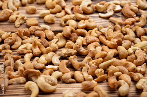 roasted cashew nuts on wooden boards close-up