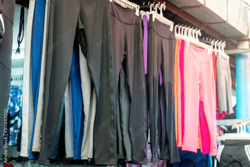Warm pants were hung on the clothesline for sale in the clothing market Warm pants were hung on the clothesline for sale in the clothing market