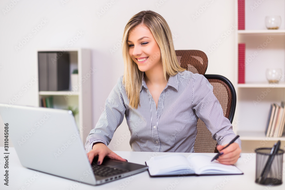 Beautiful businesswoman working at her office. Beautiful businesswoman working at her office.