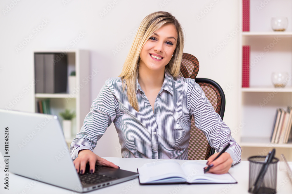 Beautiful businesswoman working at her office. Beautiful businesswoman working at her office.