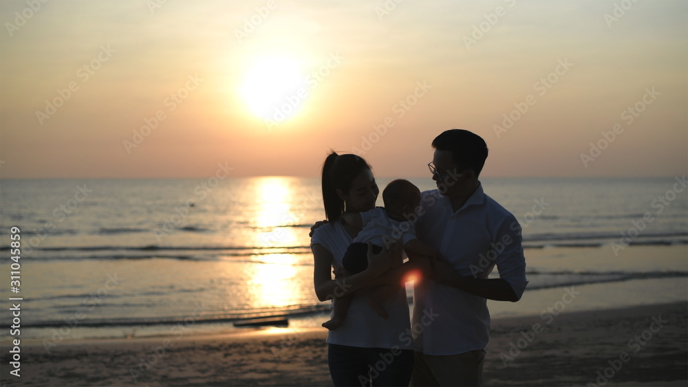 Holiday concept. Father and mother show love for children on the beach. 4k Resolution.