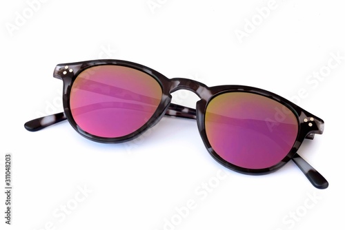 Close-Up Of Sunglasses Against White Background