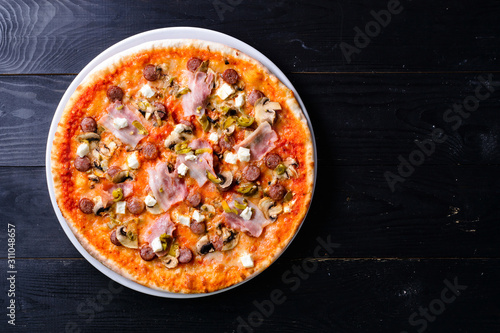 delicious pizza on a black table