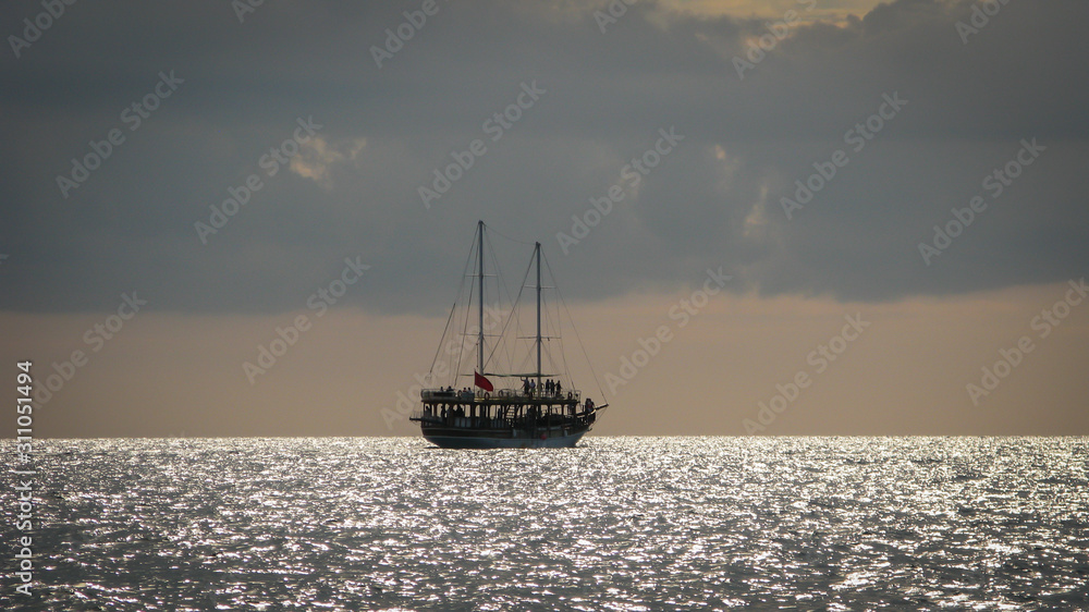 sailing ship on the horizon against the sunset sky sailing ship on the horizon against the sunset sky