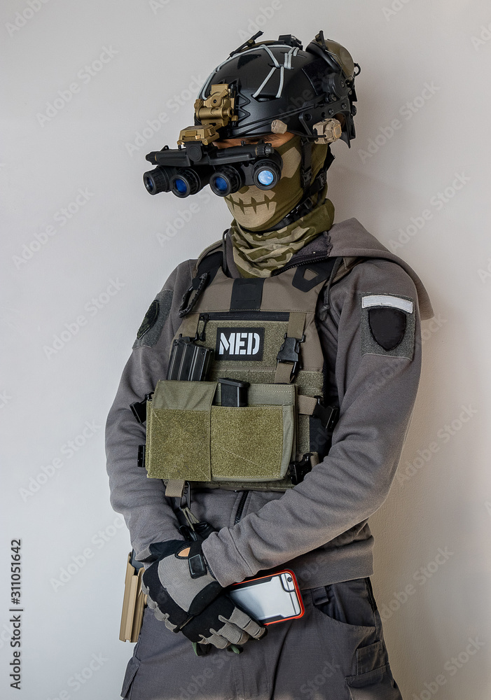 Navy SEAL United States soldier or private military contractor with Load out. Image on a grey background. Navy SEAL United States soldier or private military contractor with Load out. Image on a grey background.