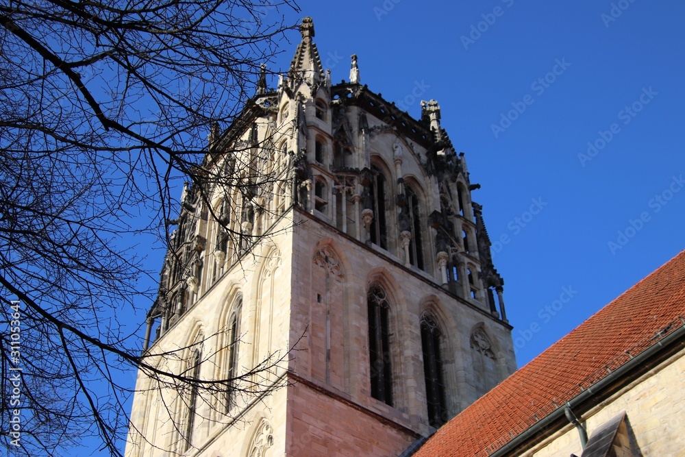 old church spire with old city surroundings old church spire with old city surroundings