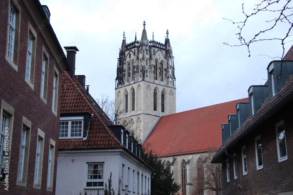 old church spire with old city surroundings