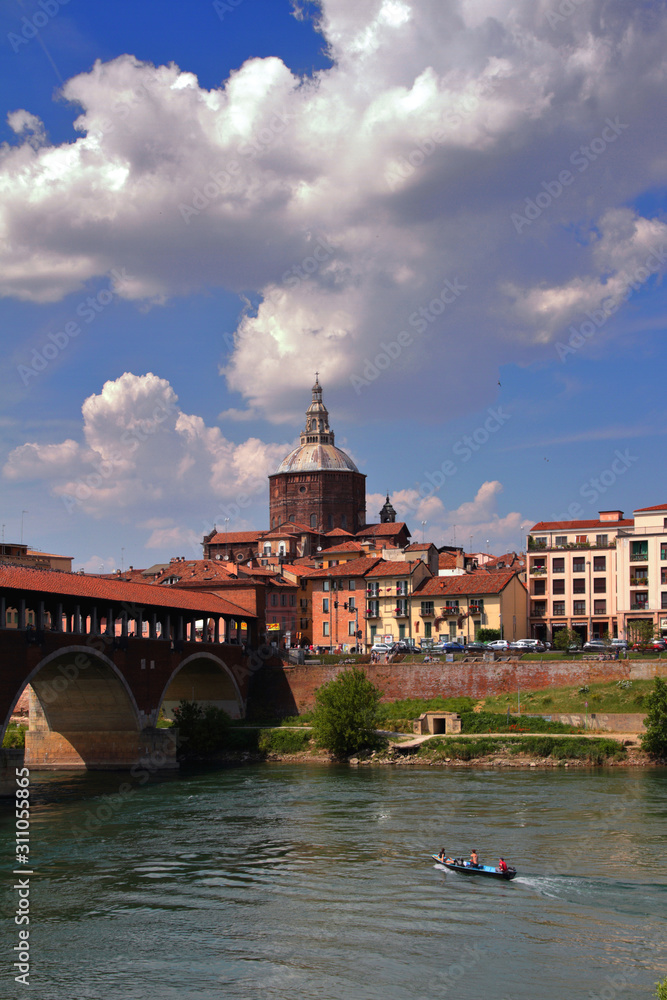 cityscape of pavia with the old bridge and river in italy