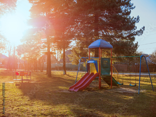 Empty playground in winter time at sunny day