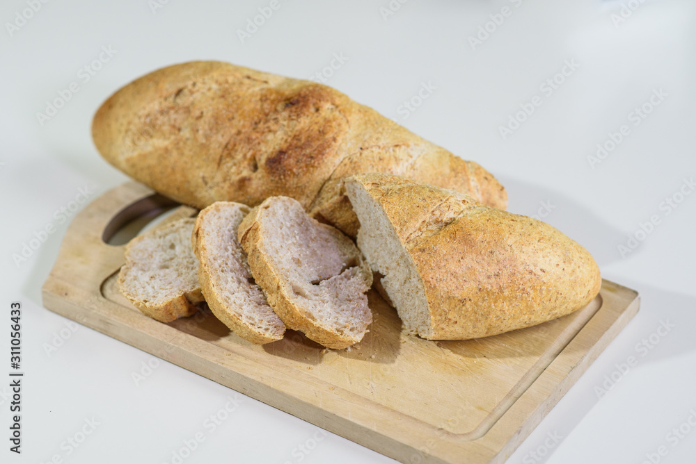Sliced french bread on a table in a cozy coffee shop Sliced french bread on a table in a cozy coffee shop