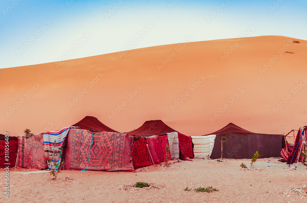 Merzougha in Sahara desert in Morocco, life of Moroccan bedouins in sahara desert - obrazy, fototapety, plakaty 