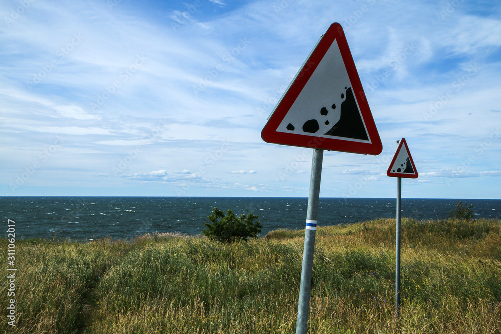 The Picture from the wild coast of Paldiski in Estonia. You can see the warning signs showing the instability of the cliffs.  