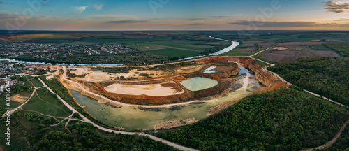Panorama of limestone open pit mine, aerial view from drone